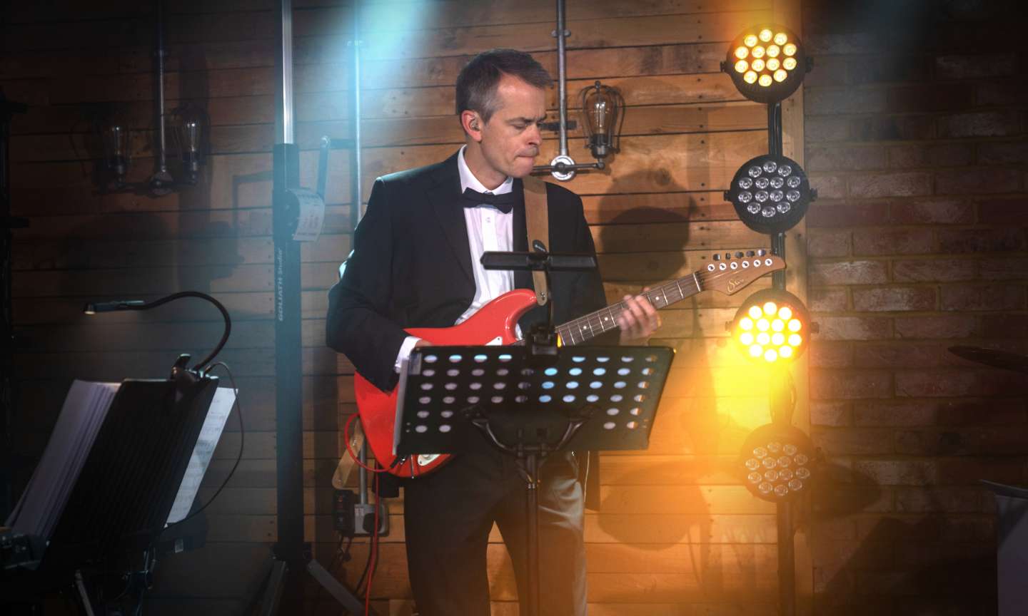 Electric guitar player performing live